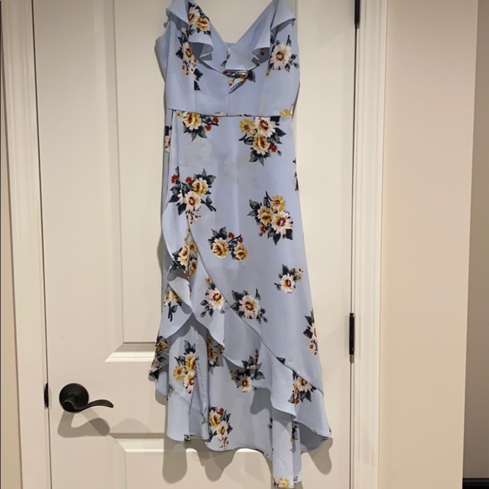 Floral  print, high low hem , ruffle front, built in shorts, sleeveless